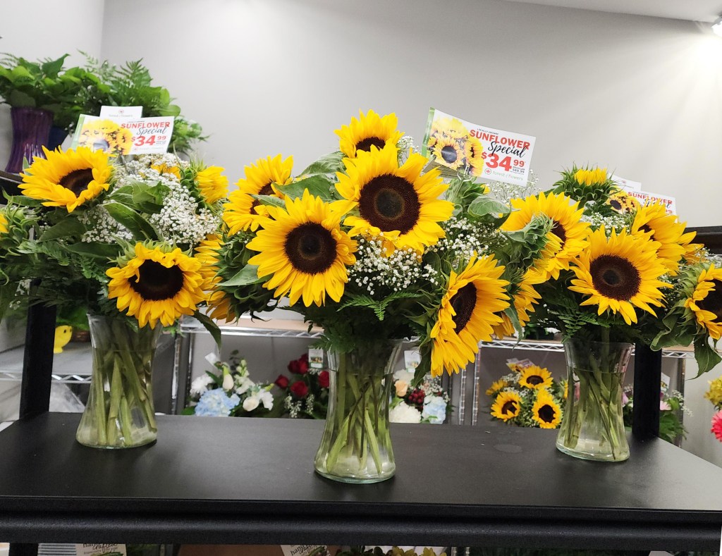 Stunning and bright sunflower vase arrangement for a promotion in Brantford and Paris.