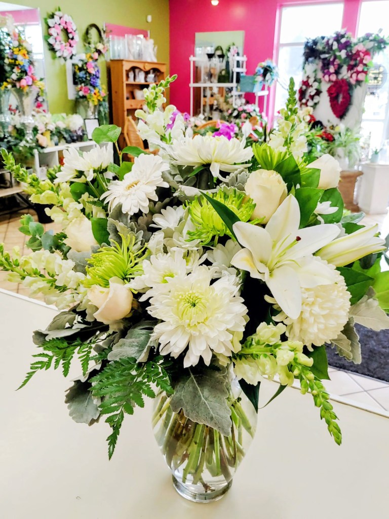 All white flower arrangement with roses, lilies and snapdragons ready for a Brantford flower delivery.
