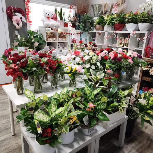 Valentineโs Day flower shop display featuring ready-made bouquets, rose arrangements, and gift plants at Forest of Flowers in Brantford and Paris, Ontario.